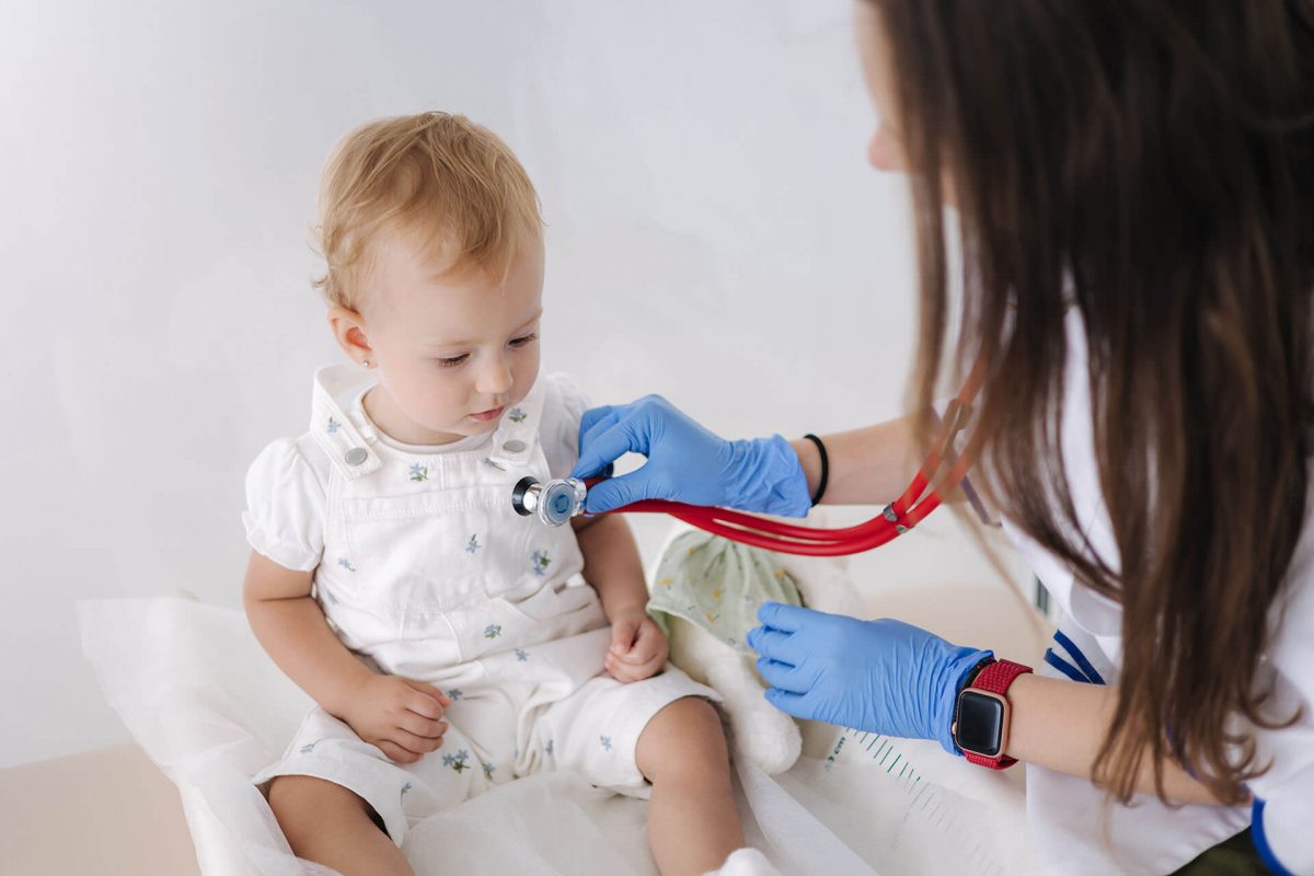 female doctor checking infant lungs urgent care Cleveland TN